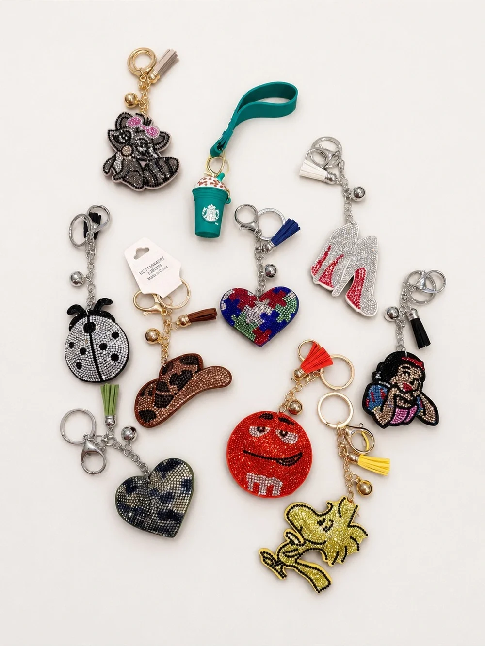 Lot of 10 assorted puffy rhinestone keychains. NEW